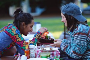 teen with food allergies eating with friend