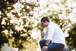 Stressed out dad sitting alone