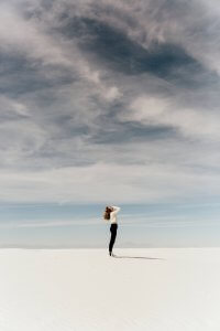 Woman Standing outside on the beach With Head In Hands Suffering From the signs of Anxiety in New Jersey. Anxiety Therapy for adults in Fanwood, NJ and Cranford, NJ Anxiety treatment can help you. Westfield and Scotch Plains anxiety counseling is available at Brave Minds Psychological Services.