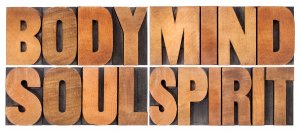 body, mind, soul and spirit - a collage of isolated words in vintage wood letterpress printing blocks, holistic wellness. Trauma therapy in Scotch Plains, NJ at Brave Minds Psychological Services Counseling Clinic for PTSD Treatment in Scotch Plains, NJ and in online therapy in New Jersey