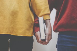 Mentor holding hands encouraging Stressed Teenage Daughter for virtual learning during COVID. You can get anxiety treatment in Westfield, NJ and Anxiety treatment in Cranford, NJ with Brave Minds in Scotch Plains, NJ