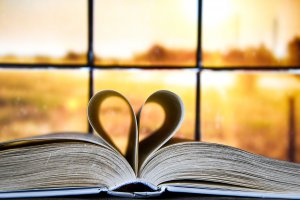 Book With Love Symbol Isolated On Window Background. Symbolizing the love languages for children and teens with anxiety for child therapy and teen therapy in Scotch Plains, NJ. You can get help with parent coaching and therapy for children with anxiety here and via online therapy in New Jersey