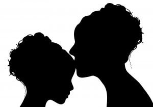 silhouette of mother kissing her daughter on white background. She works with a child therapist for anxiety and parent coaching learning about the love languages for children and teens with anxiety for child therapy and teen therapy in Scotch Plains, NJ. You can get help with parent coaching and therapy for children with anxiety here and via online therapy in New Jersey