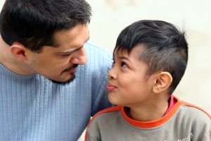 A father and son smile at one another as they talk. This represents the support anxiety counseling in Scotch Plains, NJ can offer support with child therapy for anxiety. Contact a child therapist today for more information about anxiety treatment! 