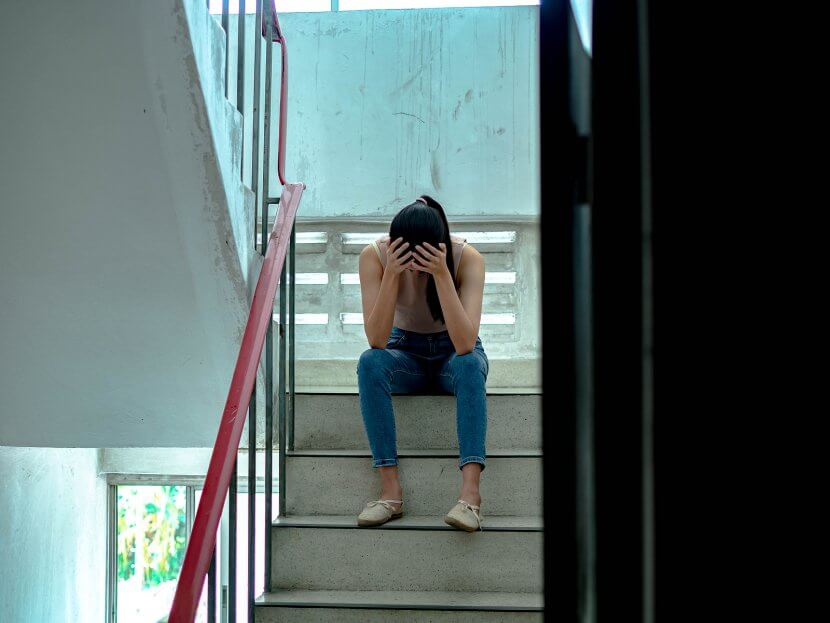 upset teen with head in her hands. Get support with child therapy and parenting counseling in Scotch Plains, NJ. Contact a parent coach for support with parenting help in Scotch Plains, NJ.