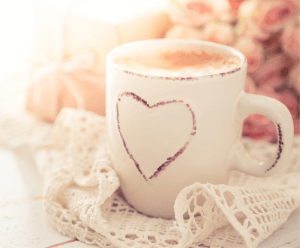 Cup of coffee with a heart on it at a new moms group
