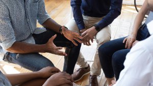 Group of people sitting in a tight circle to represent how group therapy can help teens with food allergies new jersey. Visit our Scotch Plains, NJ therapy clinic to start group therapy in New Jersey today.