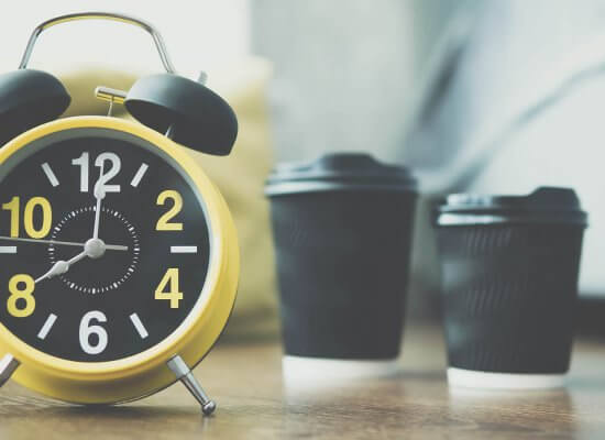 Image of a yellow old style alarm clock with two cups of coffee behind it. Parenting Advise Scotch Plains, NJ, Parenting Help in Scotch Plains, NJ, Parenting Counseling in Scotch Plains, NJ | 07076