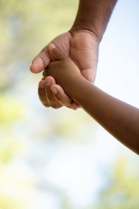 An image of a father and child holding hands. Child Counseling Scotch Plains, NJ, Parenting Help in Scotch Plains, NJ, Parenting Counseling in Scotch Plains, NJ | 07076