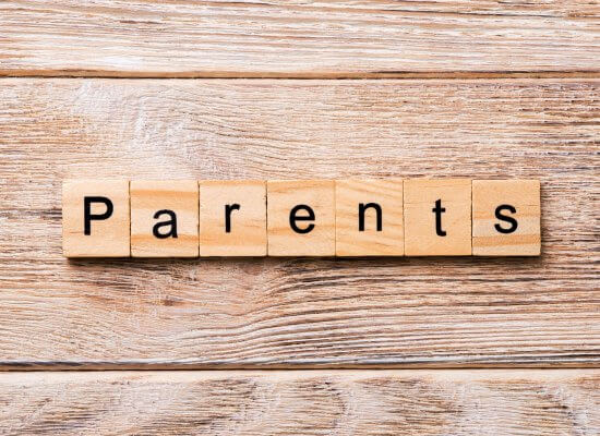Image of parents spelled out in scrabble letters on a wood background. Anaphylactic reaction in New Jersey gives parents, kids, and teens. Get help with online therapy for teens and child therapy for anxiety in Scotch Plains, NJ 07033.
