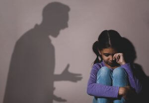 Image of a child crying next to the shadow of her father yelling at her. Are you the adult child of a parent who is a narcissist? Dealing with narcissistic abuse is hard. Reach out today to talk with an EMDR therapist in Scotch Plains, NJ 07076.