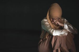 Image of a woman in a hijab sitting with her head on her fist. Have you been looking for "EMDR therapy near me"? Contact us today to start EMDR therapy in New Jersey. We can help you deal with emotional trauma from a narcissist in Scotch Plains, NJ 07033.