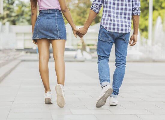 Teen couple walking holding hands. A teen counselor gives teen dative violence warning signs. We can give parenting help if you are worried about your teen. We can also help with counseling for teens in Scotch Plains, NJ.