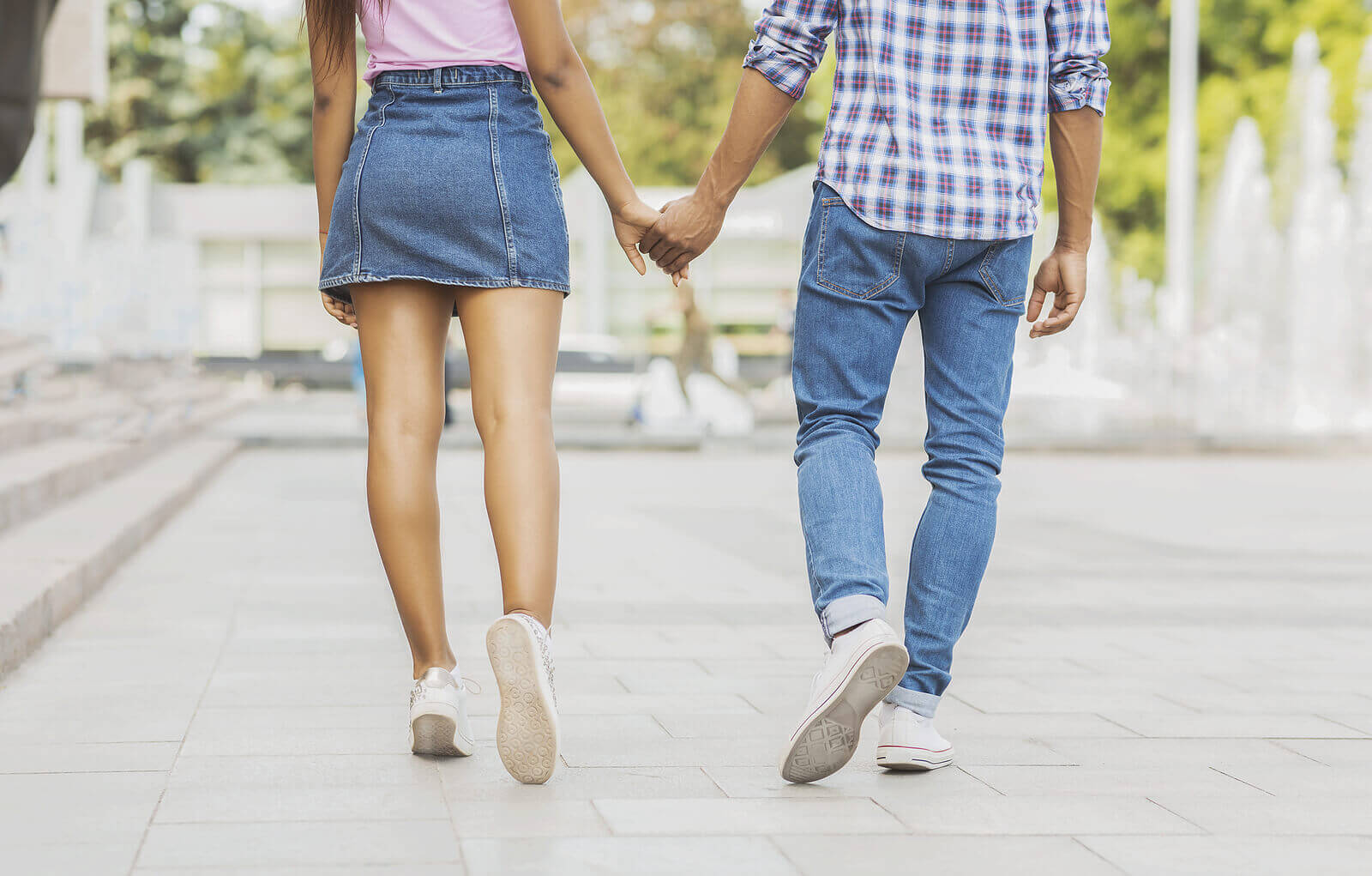 Teen couple walking holding hands. A teen counselor gives teen dative violence warning signs. We can give parenting help if you are worried about your teen. We can also help with counseling for teens in Scotch Plains, NJ.