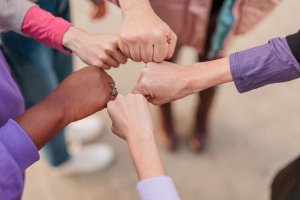 Image of four fists in a circle. Have you been searching for a "trauma therapist near me" in Scotch Plains, NJ? Everything happening with Roe v Wade has been causing a lot of trauma. Reach out today to speak with a trauma therapist about starting trauma therapy in Scotch Plains, NJ.