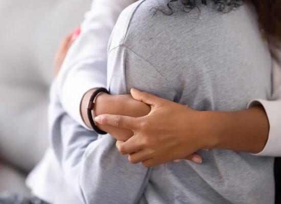 Image of a mother hugging her daughter. If you teen experienced dating violence online therapy for teens in New Jersey can help. We have give you parenting help on what to do next. Call today to talk to a teen counselor for parenting advice in Scotch Plains, NJ 07076. Connect with us today.