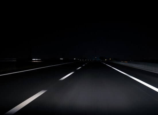 Dark road in the middle of the night. Driving anxiety treatment in Cranford, NJ can help you thrive.