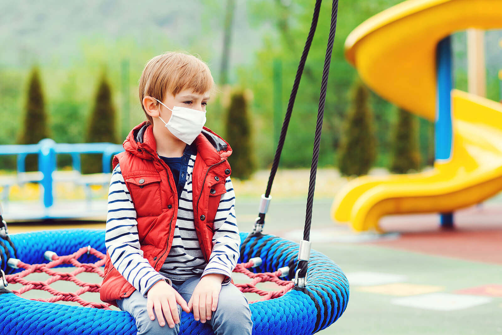 Image of a boy sitting on a swing at the park by himself showing the struggles that child therapy for anxiety can help address. A child therapist in Scotch Plains, NJ could help him by addressing his selective mutism.