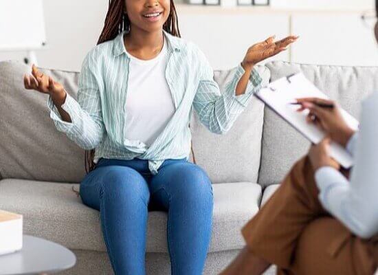 Image of a woman talking with a therapy intern. Which shows that Interns are a great option for Westfield, NJ counseling.