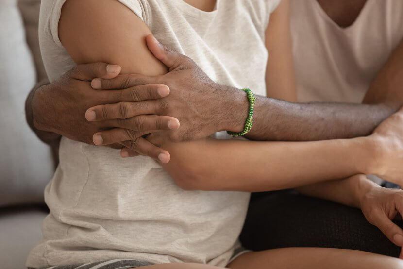A close up of a person hugging a family member. Learn how parent coaching in Scotch Plains, NJ can offer support in addressing hard topics. Contact a trauma therapist in Scotch Plains, Nj for support with trauma therapy in Scotch Plains, NJ and more.