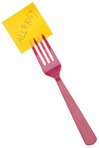 A fork holds a post-it note with the word allergies on it. Learn how you can support teens with food allergies in New Jersey today. Search “signs of anxiety Westfield, NJ” for support in overcoming food allergies and anxiety.