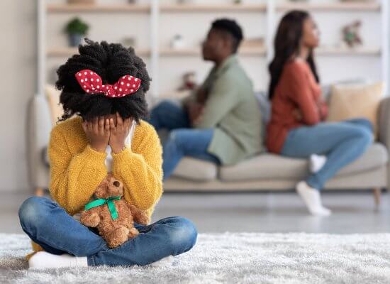 A child sits with their head down as their parents sit facing away from one another. This could represent the trauma a trauma therapist in Scotch Plains, NJ can help you overcome. Learn more about trauma therapy in Scotch Plains, NJ by searching for a trauma therapist near me.