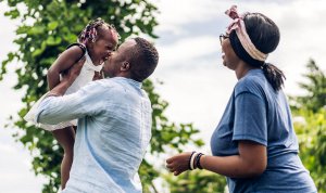 Image of a family of 3 playing. Representing the connection that counseling or therapy in Branchburg, NJ can bring you, your child, or your family.