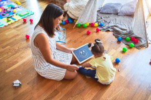 Woman participating in play therapy with a child | Trying to figure out if child therapy in Branchburg, NJ is right for your child? Here in our Branchburg, NJ office we specialize in child therapy. Get the help you need today! 