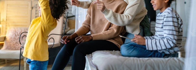 A close up of a family smiling while cheering together. Learn how a couples counselor in branchburg, nj can help you better understand your partner's family. Search for counseling in branchburg, nj or couples therapy scotch plains, nj to learn more.