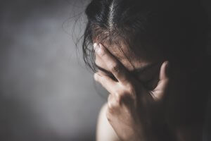 A close up of a woman covering her face. This could represent the pain of relationship issues that a couples counselor in branchburg, nj can address. Learn more about marriage counseling westfield, nj and how counseling in branchburg, nj can help today.