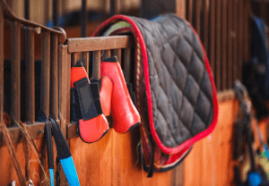 Horse saddle and other equestrian equipment ready to be packed and brought on a trip from cold to warm weather. Our equestrian therapists in Scotch Plains, NJ and Branchburg, NJ can help you cope with equestrian-related anxiety, such as riding anxiety.