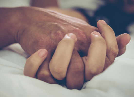 a couple holding hands and engaging in sex after a traumatic birth experience. Contact a couples therapist in Scotch Plains or Branchburg today for some guidance on getting back into a better sex life after a traumatic birth experience.