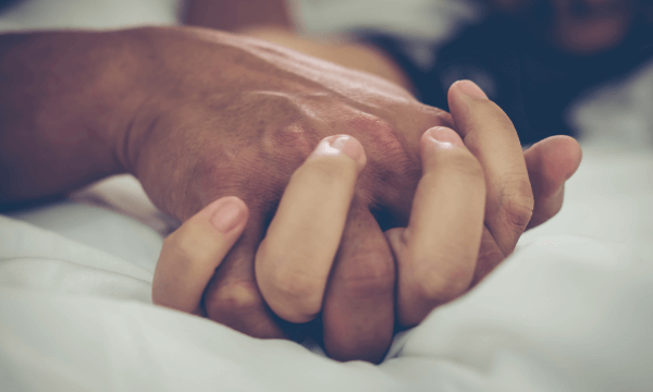 a couple holding hands and engaging in sex after a traumatic birth experience. Contact a couples therapist in Scotch Plains or Branchburg today for some guidance on getting back into a better sex life after a traumatic birth experience.