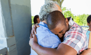 An image of two individuals embracing each other with a hug. One individual is older than the other and this may symbolize the strength in providing affirming support for transgender youth. Find an affirming transgender youth counselor in Scotch Plains or Branchburg, NJ today!