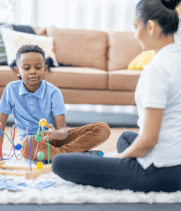A young child and parent engaging in at-home structured educational play to help with child anxiety treatment. Look for a play child therapist in Scotch Plains of Branchburg today.