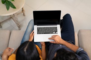 A couple sit together while typing on a laptop. This could represent the search for the right family therapist in Branchburg, NJ. Learn more about online therapy in New Jersey and the help a group therapist in Scotch Plains, NJ can offer. 