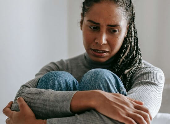 A person experiencing emotional distress during an art therapy session with a trauma therapist in Branchburg, NJ. Art therapy provides a safe space for processing racial stress and trauma at our healing center serving Branchburg, Somerville, and surrounding areas.