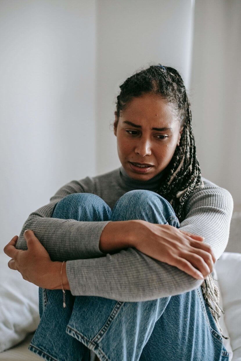A person experiencing emotional distress during an art therapy session with a trauma therapist in Branchburg, NJ. Art therapy provides a safe space for processing racial stress and trauma at our healing center serving Branchburg, Somerville, and surrounding areas.