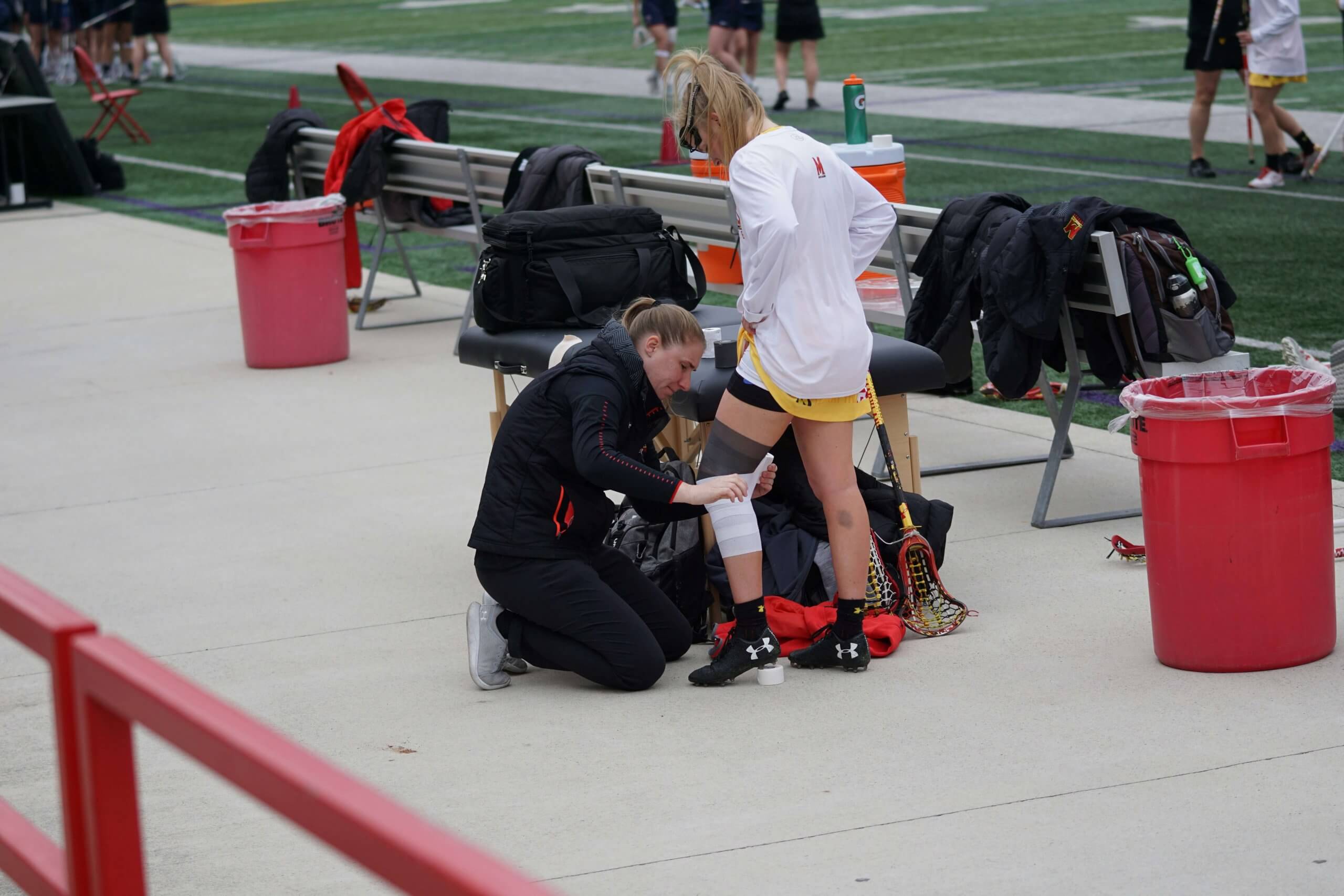 Professional sports injury care being administered to a young athlete demonstrates the comprehensive approach needed for teen injury recovery. EMDR therapy can address the psychological trauma that often accompanies physical injuries, helping athlet