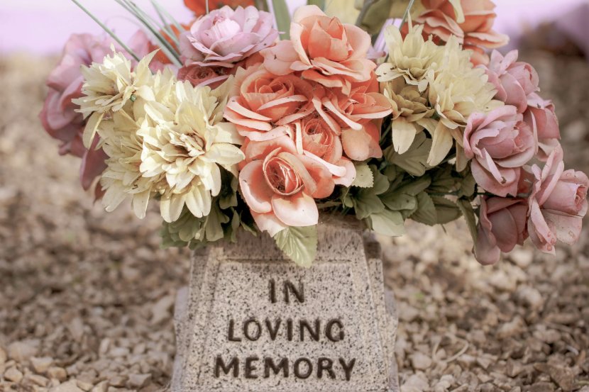 A gentle memorial arrangement of soft pink, peach, and cream flowers rests beside a stone marker reading "In Loving Memory," representing the grieving process. What does grieving mean? It encompasses emotional, physical, and spiritual responses to loss. Grief counseling NJ provides professional support for grieving symptoms in Branchburg, NJ. Loss and grief in Scotch Plains, NJ affects many families seeking compassionate guidance. Grief counseling NJ helps address grieving symptoms such as sadness, difficulty concentrating, and emotional waves.