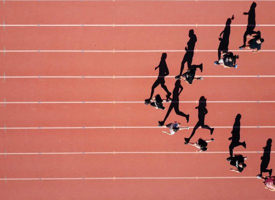 Overhead view of competitive athletes running on track representing mental performance and focus in sports. EMDR therapist in Somerville, NJ helps athletes overcome performance anxiety and mental blocks through EMDR therapy in Scotch Plains, NJ. Brave Minds provides adolescent therapy NJ in Branchburg and performance anxiety NJ treatment near the Somerville area. EMDR therapy NJ for teen athletes struggling with sports confidence.