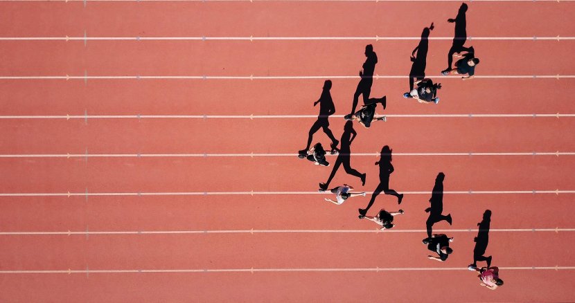 Overhead view of competitive athletes running on track representing mental performance and focus in sports. EMDR therapist in Somerville, NJ helps athletes overcome performance anxiety and mental blocks through EMDR therapy in Scotch Plains, NJ. Brave Minds provides adolescent therapy NJ in Branchburg and performance anxiety NJ treatment near the Somerville area. EMDR therapy NJ for teen athletes struggling with sports confidence.