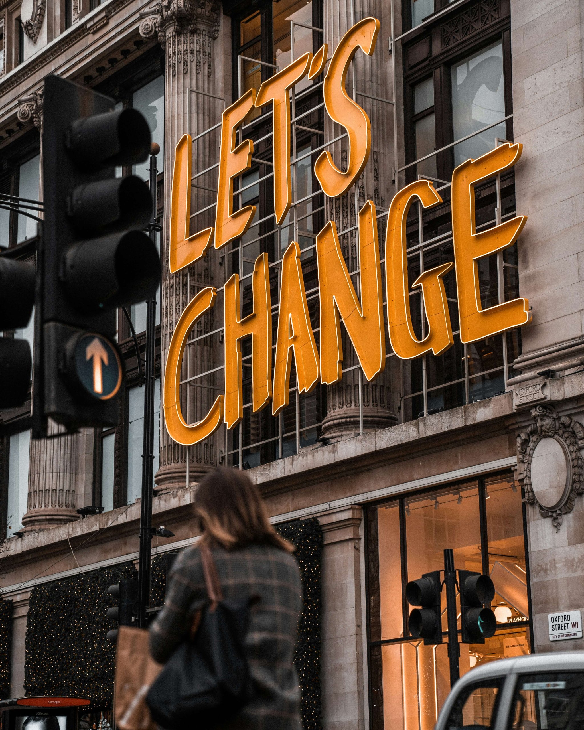 A bold "Let's Change" illuminated sign on a city street, symbolizing the courage to grow emotionally in Scotch Plains. Serving Scotch Plains, Branchburg, and Somerville — supporting emotional regulation skills NJ families need to thrive and embrace positive change.