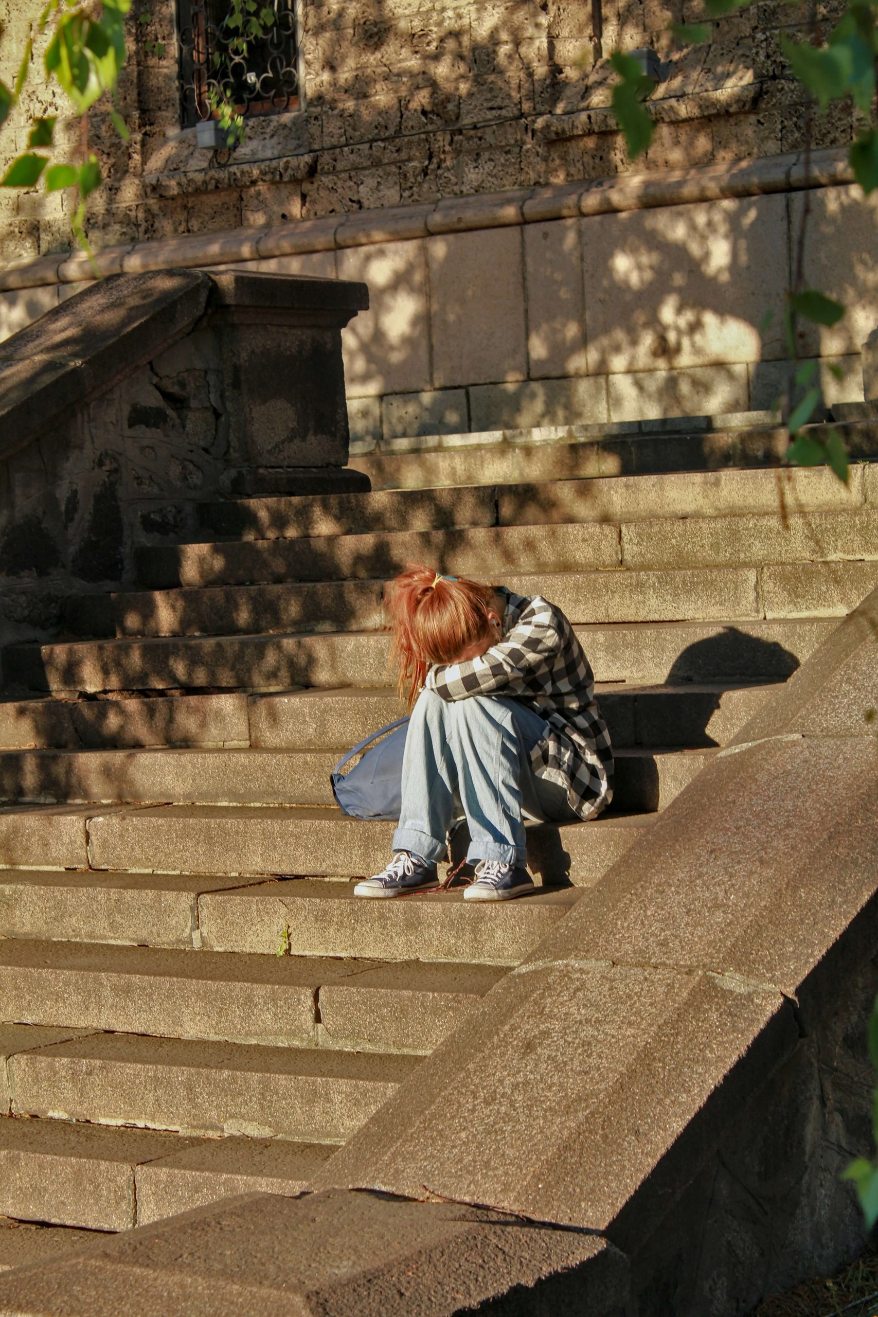 A contemplative moment captured on weathered stone steps, representing the journey of emotional growth and self-reflection. At our practice serving Branchburg (08853, 08836, 08807, 08869, 08821, 08876) and Somerville (08876, 08869, 08807, 08836, 08880, 08805), we provide child therapy in New Jersey focused on building emotional regulation skills. Through parent coaching NJ families trust, we help children and teens develop mindfulness and coping strategies. Our counseling for teens Branchburg NJ approach emphasizes guidance and support during challenging moments.