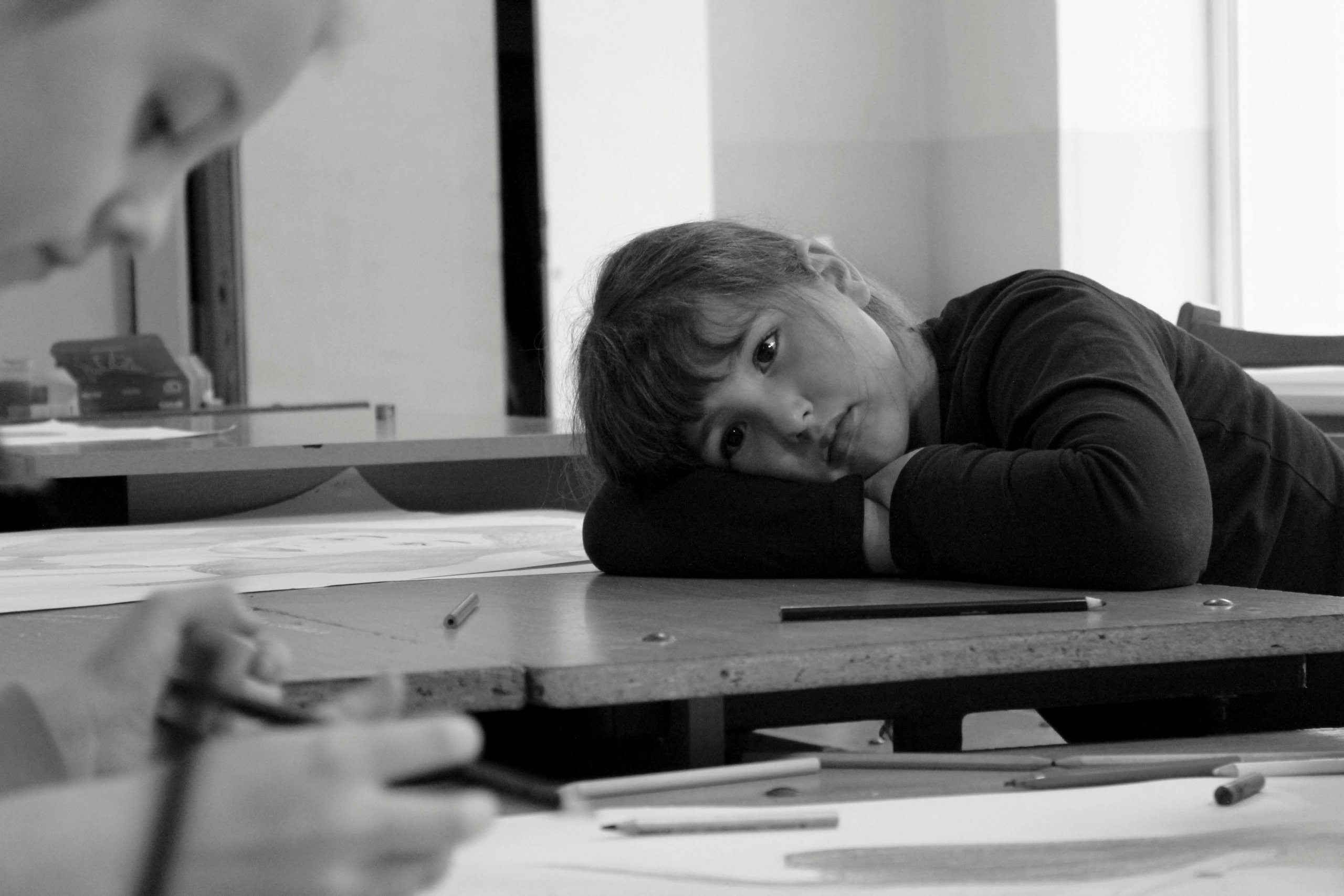 Child showing signs of anxiety during a classroom moment in Scotch Plains, NJ. Serving Scotch Plains, Plainfield, and Westfield families seeking selective mutism treatment and school portraits support.