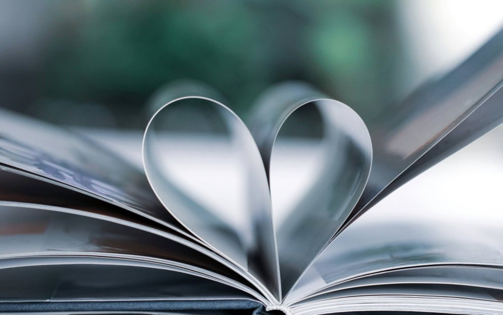 An open book with its pages folded into a heart, symbolizing care and healing, in Scotch Plains. Serving Scotch Plains, NJ with therapy for caregivers NJ, supporting those who give so much of themselves to others.